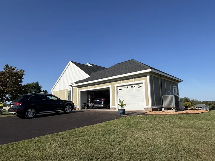 Updated siding and trim around the attached garage