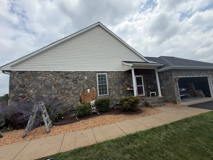 Original stone veneer covering the side elevation before exterior remodeling